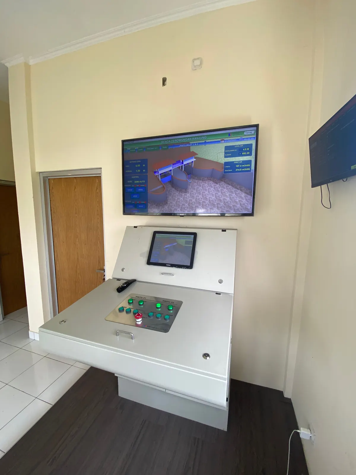 SCADA operator desk with HMI and control buttons